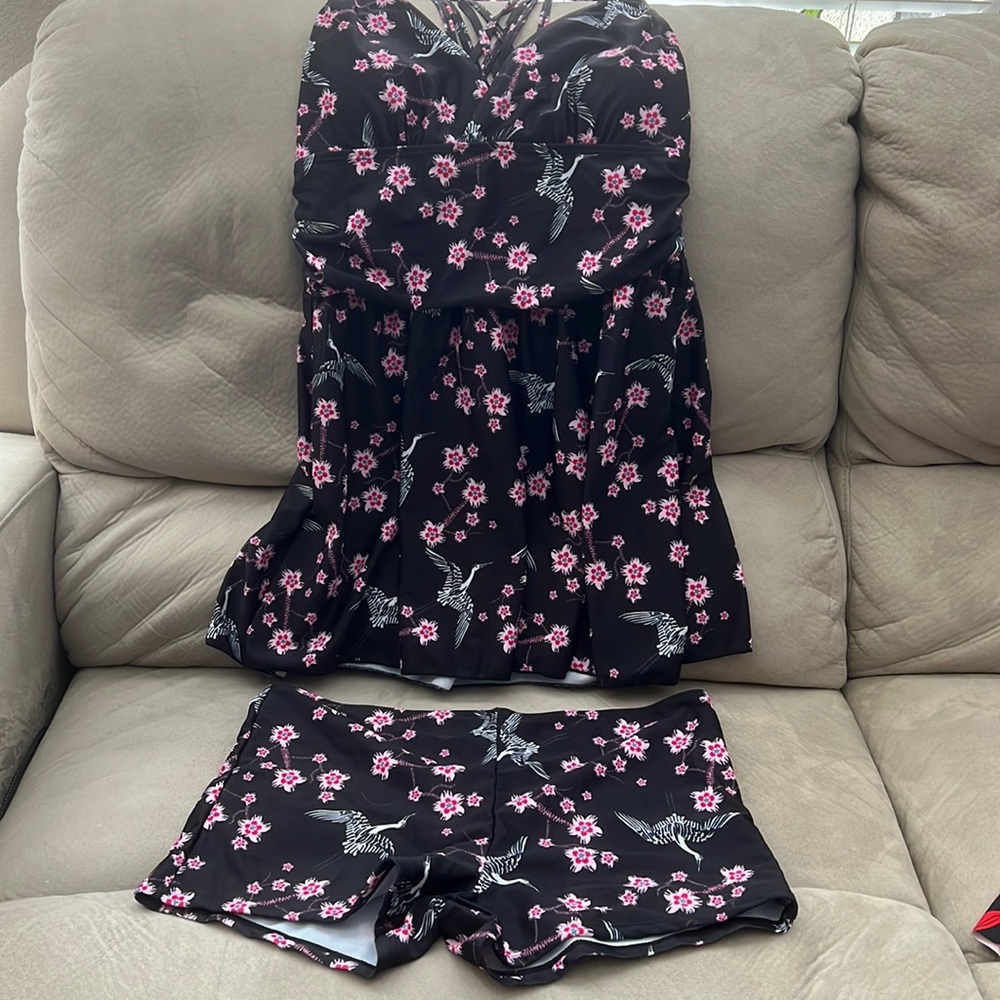 Swim suit dress. 2 piece, short bottom.  Molded cups and cross cross back